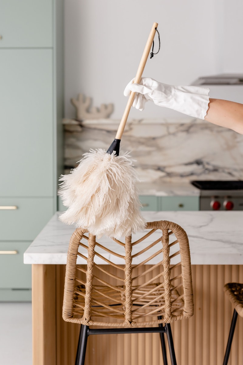 Cleaner washing an upholstered chair